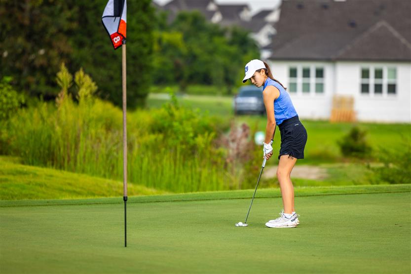 Students play golf